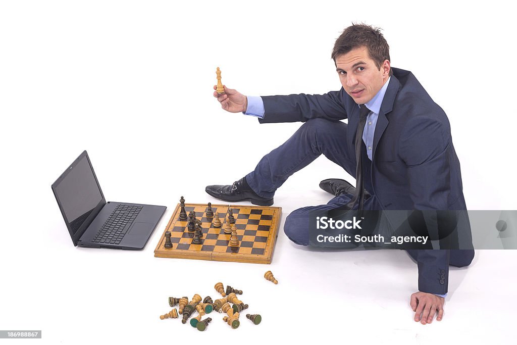 Competition laptop and businessman play chess Achievement Stock Photo