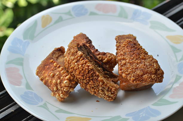 istock Pork cracklings on a plate 186989124