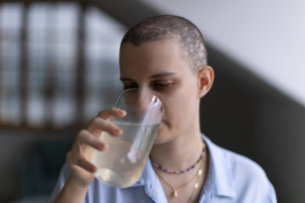 istock Young woman drinking juice at home 1869893802