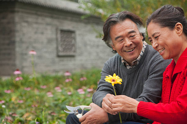 istock Happy Senior couple with flower 186989435