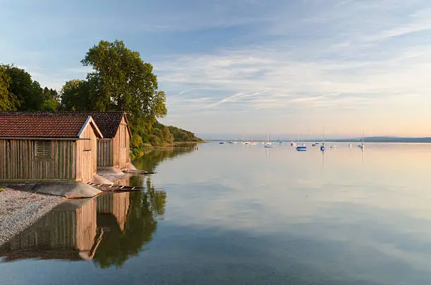 These boathouses are located at Breitbrunn, a village at lake Ammersee in Upper Bavaira.