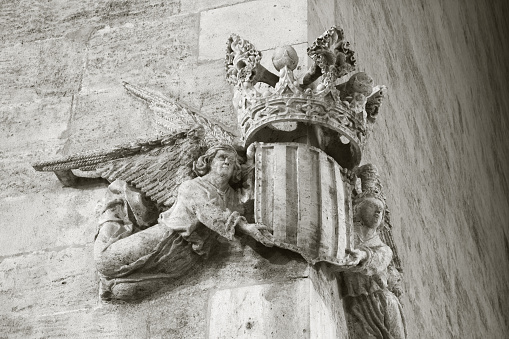 Valencia - The relief of Royal arms of Kingdom of Valencia on the facade of Lonja de la Seda building.