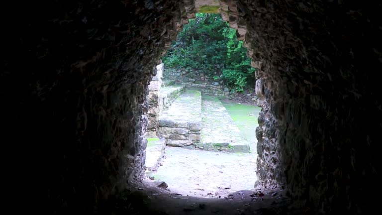 Coba Maya Ruins ancient buildings pyramids light tunnel Mexico.