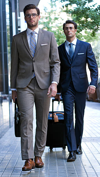 istock two young executives arriving at the hotel 186990363
