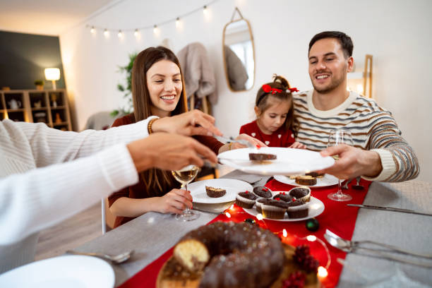 istock Multi-generational Caucasian family, having dessert during a Christmas lunch 1869905669