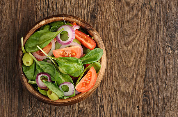 istock Salad with tomato, olives and spinach 186990616