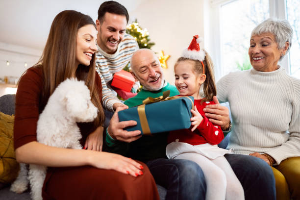 istock Multi-generational family exchanging Christmas and New year presents 1869906729