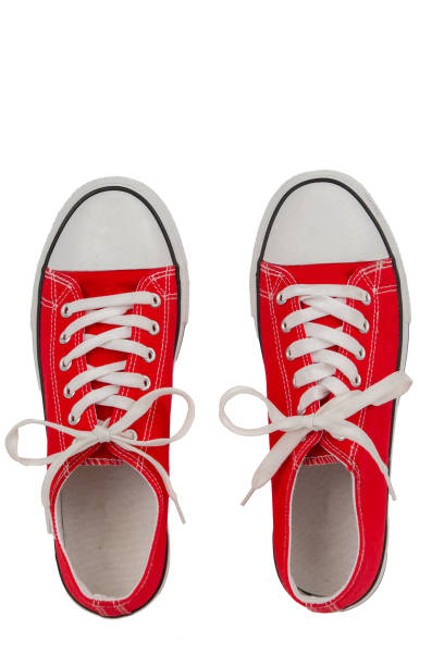 istock Red gum shoes isolated on white background. Top view. 1869908812