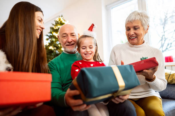 istock Multi-generational family exchanging Christmas and New year presents 1869908832