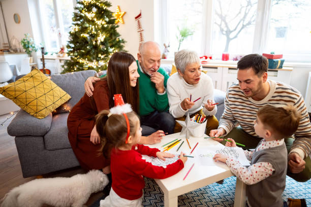 istock Multi-generational family, coloring the coloring book, during Christmas celebration 1869910461