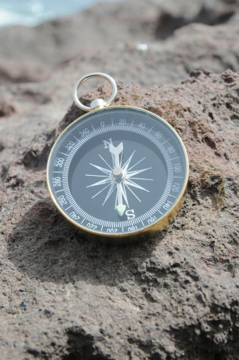 One Compass on the Rocks near the Atlantic Ocean