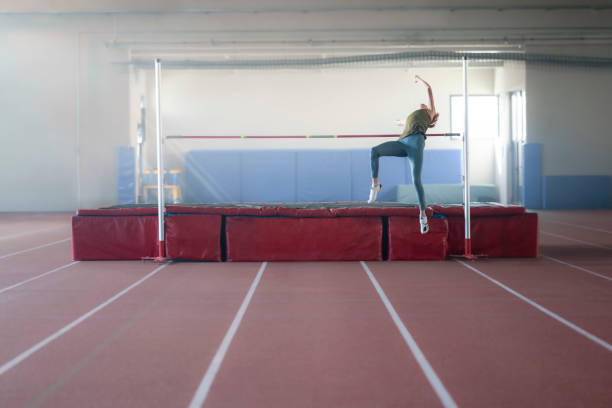 istock Athlete woman doing high jump 1869912044