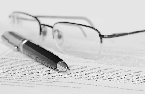istock Pen and glasses on paper 186991345