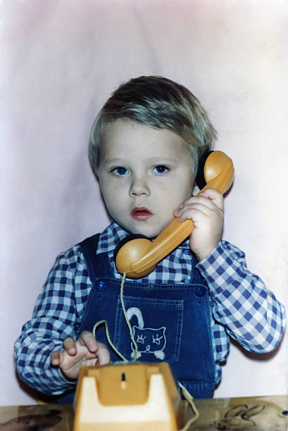 istock 3-years-old boy calling by phone 186991846