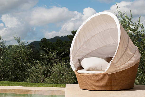 Day bed by a pool in Tuscany