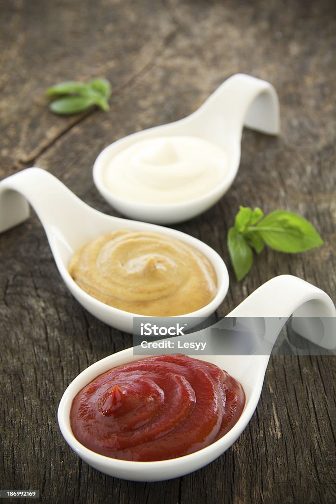 Assorted sauces: mayonnaise, ketchup, mustard. Backgrounds Stock Photo