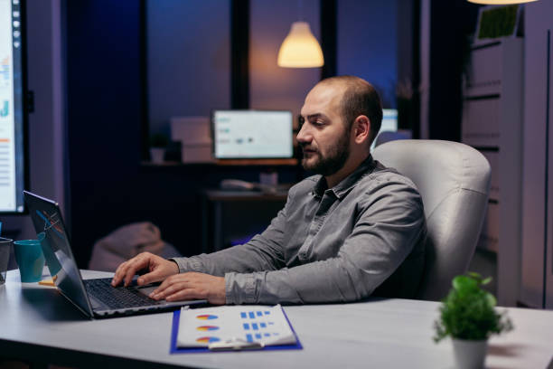 istock Concentrated young businessman working in office 1869922149