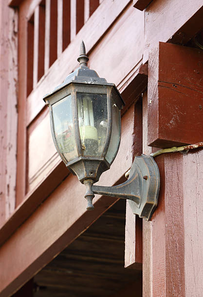 istock lamp hanging on wooden wall 186992930