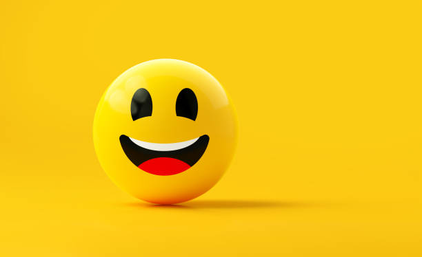 istock Yellow Sphere Textured With Happy Face Emoji On Yellow Background 1869932113