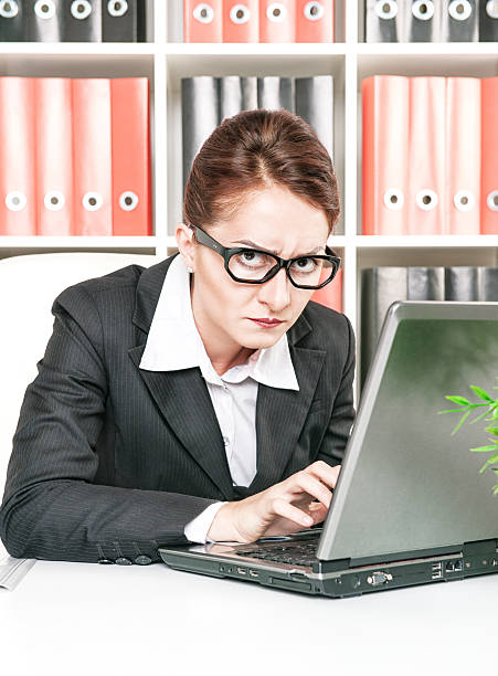 istock Frown business woman working 186993238