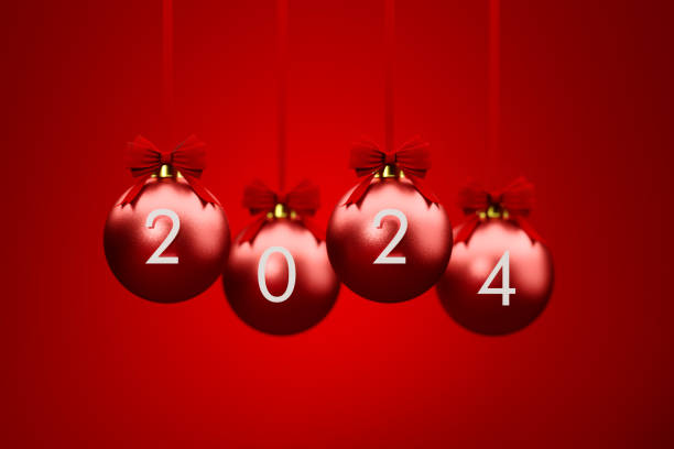 istock 2024 Written Red Christmas Baubles Over Red Background 1869937400