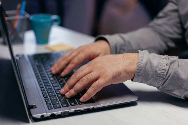 istock Hands of office manager over keypad 1869938006