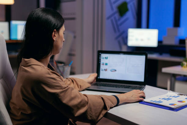 istock Focused entrepreneur checking business reports 1869941203