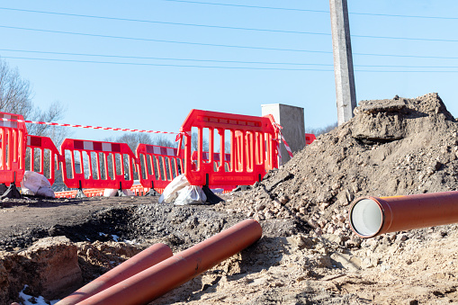 Street repairs with red demarcation elements on it