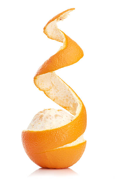 istock orange with peeled spiral skin 186995128