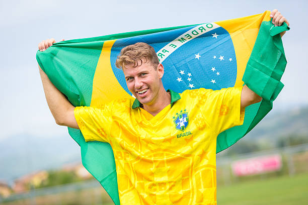 istock Brazilian Soccer Player and Flag 186995279