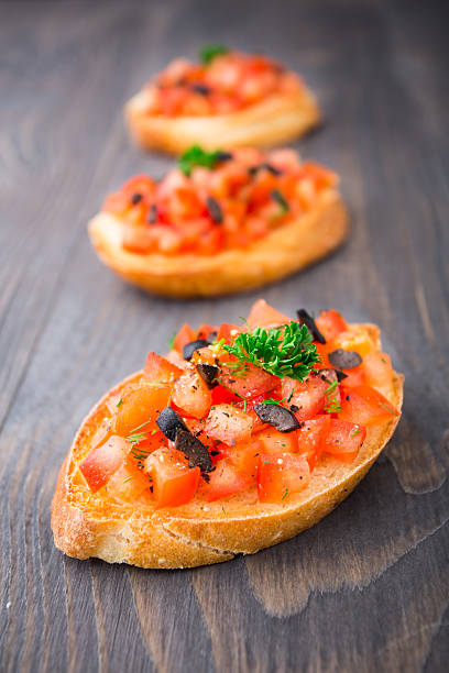 istock Tomato bruschetta topped with olive 186995759