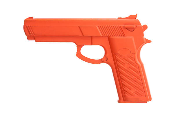 istock Dirty red training gun isolated on white 186996218