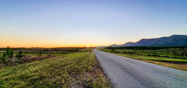 The road less traveled Deserted road, Sunset, Mountains traveled stock pictures, royalty-free photos & images