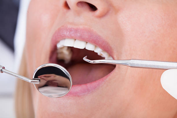 istock Female Patient Examined By Dentist 186997945