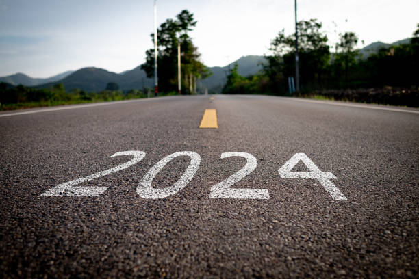 istock The word 2024 is written on an empty road. 1869981477