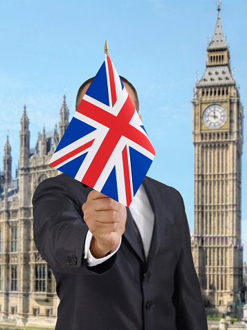 Businessman holding British flag