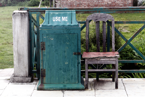 use me dustbin with empty chair