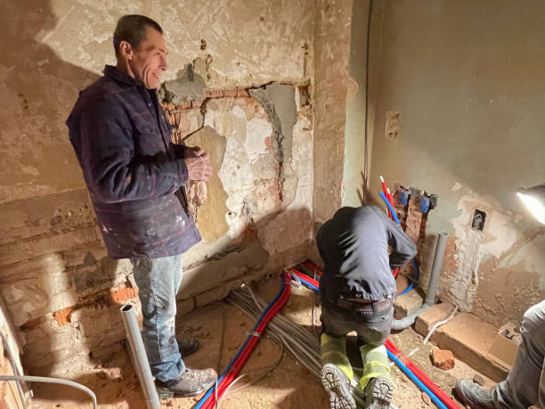 istock Electrician working working on building site, technicians install wiring 1869992053