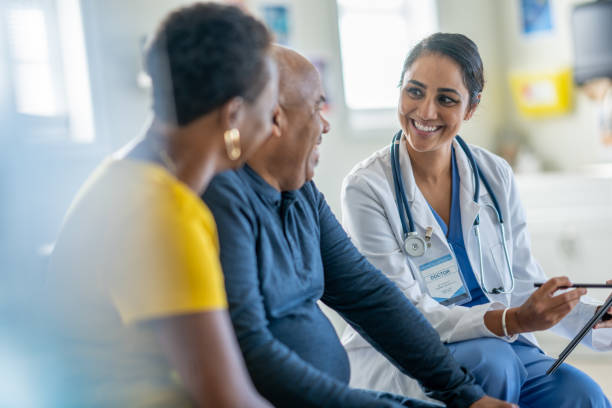 istock Doctor Talking with a Senior Couple 1869998934