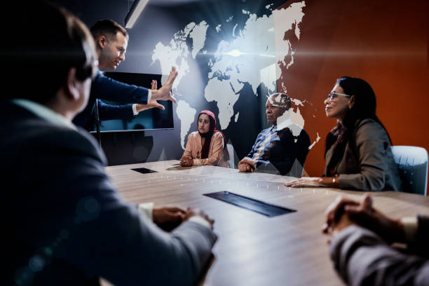 Businessman using hologram during a meet at office