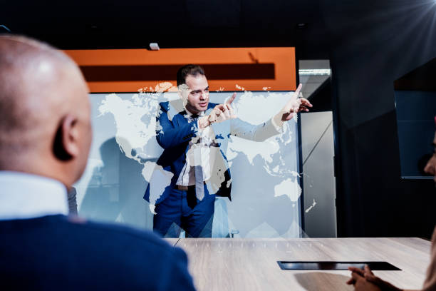 istock Businessman using hologram during a meet at office 1870030622