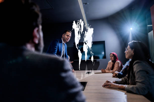 istock Businessman using hologram during a meet at office 1870030624
