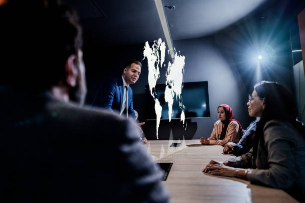 istock Businessman using hologram during a meet at office 1870031129