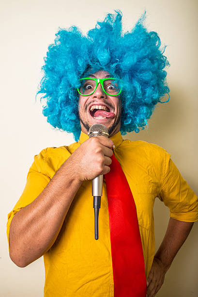 istock crazy funny young man with blue wig 187004364