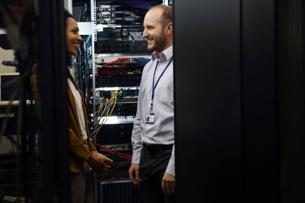 istock IT professionals having meeting in server room 1870044709
