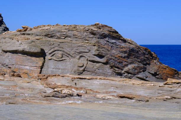 istock God Aeolus carved on the rock at Kavalourko Beach 1870046300