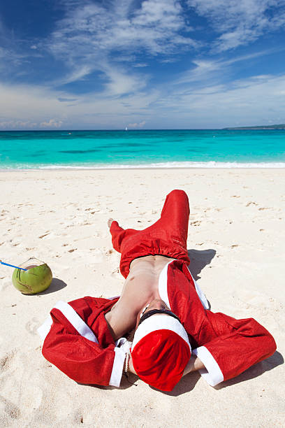 istock Santa Claus on beach relaxing 187006736