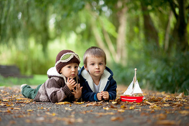 istock Two boys in a park with boat 187007301