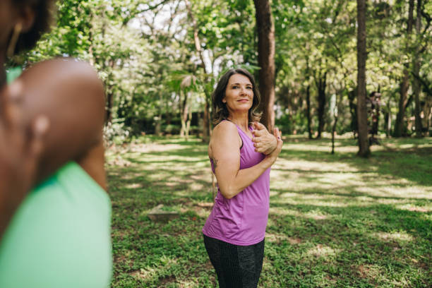 istock Mature woman stretching on the public park 1870082442