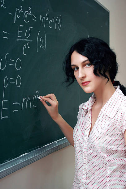 istock Girl at the blackboard 187008439